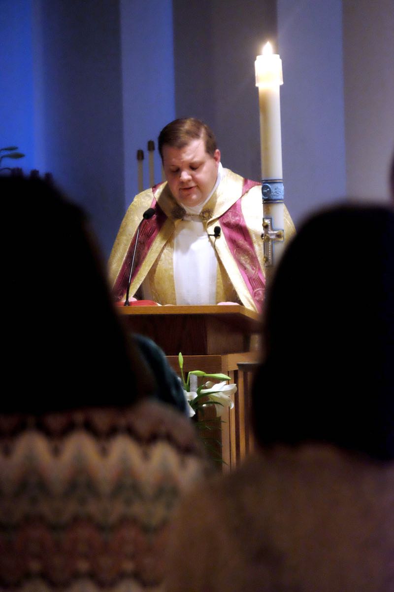 At the dark and somber Easter Vigil in 2017. Which doesn't seem like nine years ago, but it was. (Credit: Dennis E. Powell)