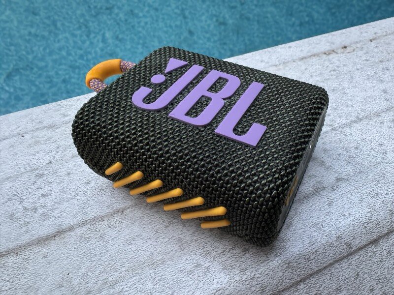 Delightfully small and in a variety of fun color themes, the JBL Go 3 fits just fine on the edge of an above ground pool. (Credit: Timothy R. Butler)