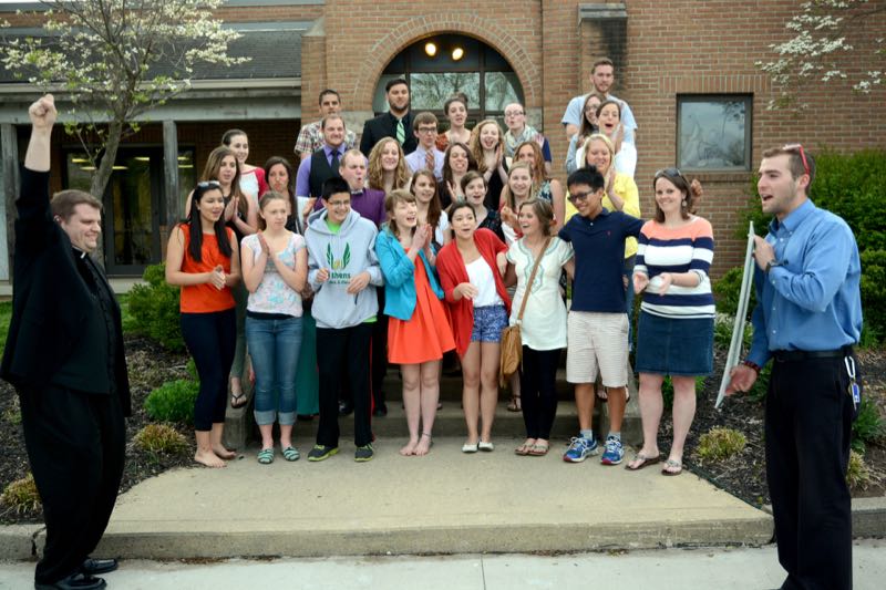 Parish high schoolers raised money by perticipating in the annual "Race for a Reason." When it was revealed that had raised nearly $7000 for their activities, no one was more excited than Father Mark was. (Credit: Dennis E. Powell)